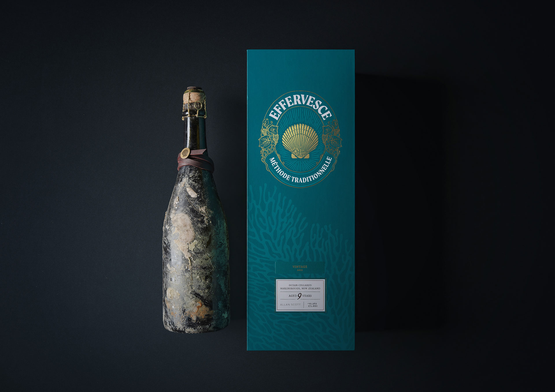 a bottle of wine next to a box