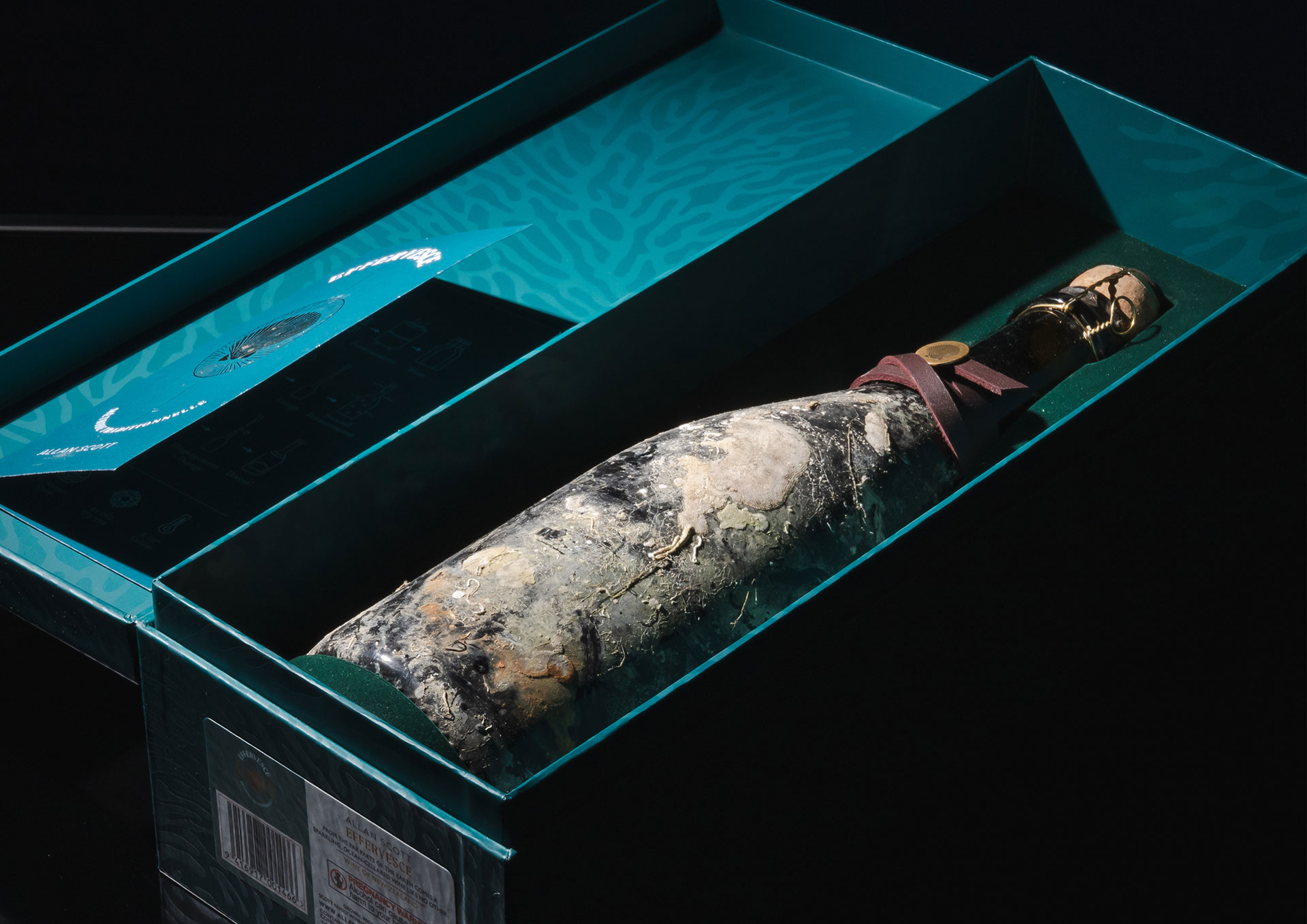 A bottle of Allan Scott Effervesce in a custom made box
