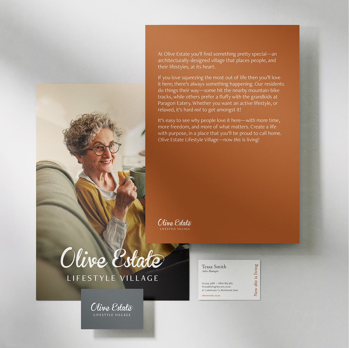 Olive estate lifestyle village branding collateral featuring brochure, business card and lifestyle imagery of a resident enjoying coffee.