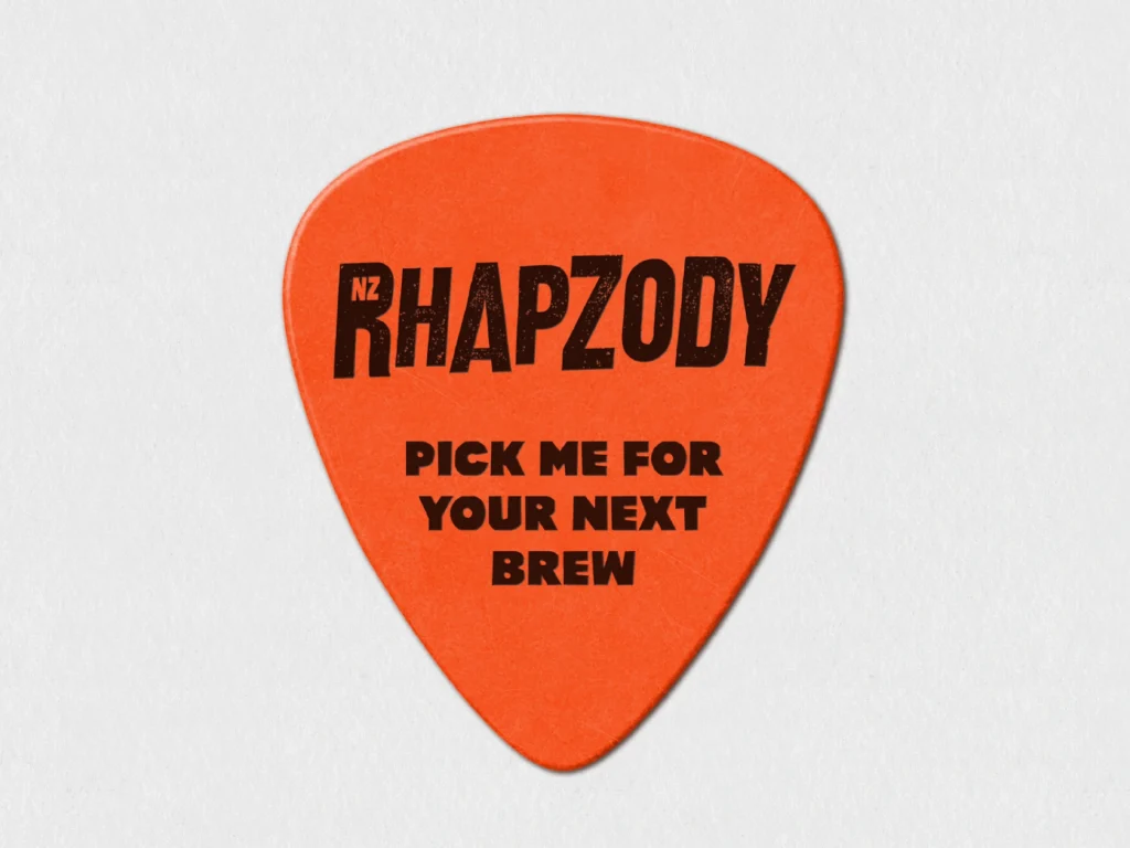 Custom orange guitar pick featuring NZ Rhapzody name and their slogan "Pick me for your next brew."