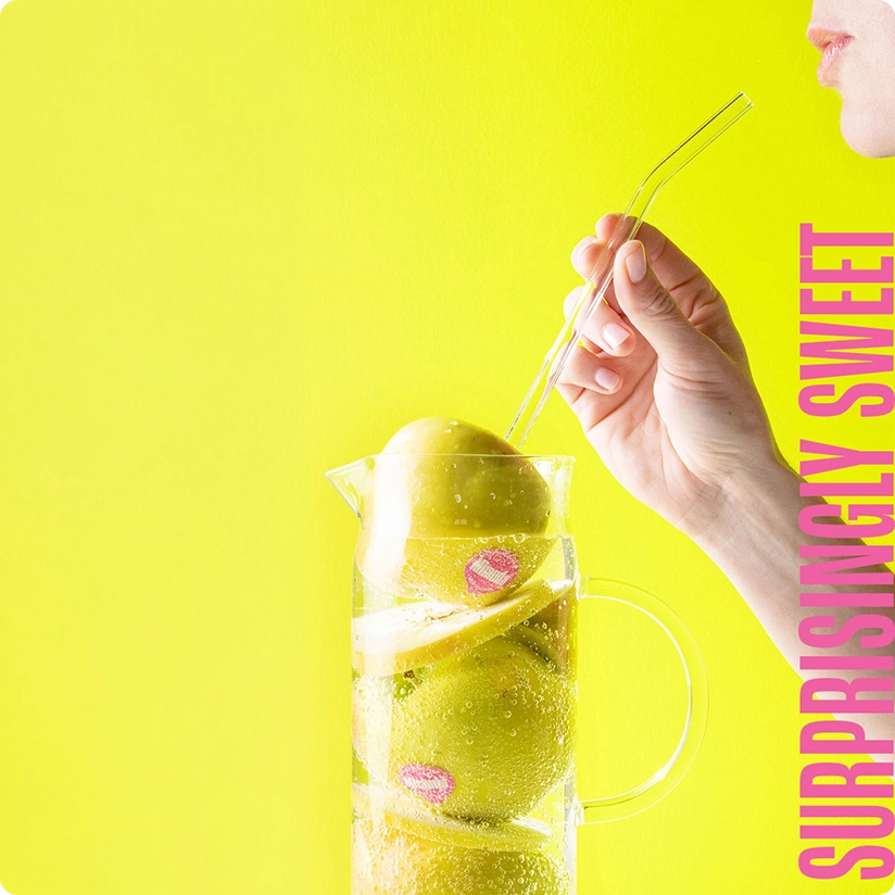 Green apples in a bright pitcher