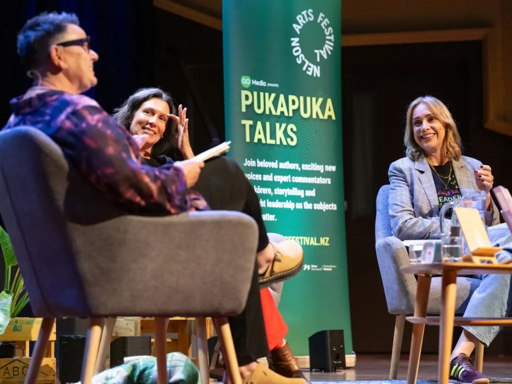 pukapuka talks pull up banner on stage during event