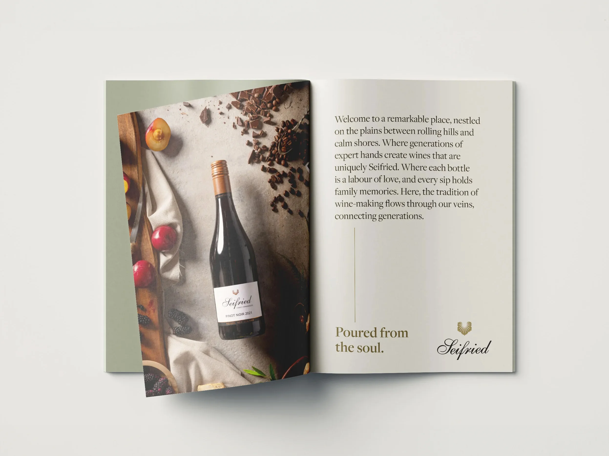 An open magazine featuring Seifried Estate advertisement of a wine bottle alongside winery story collateral.